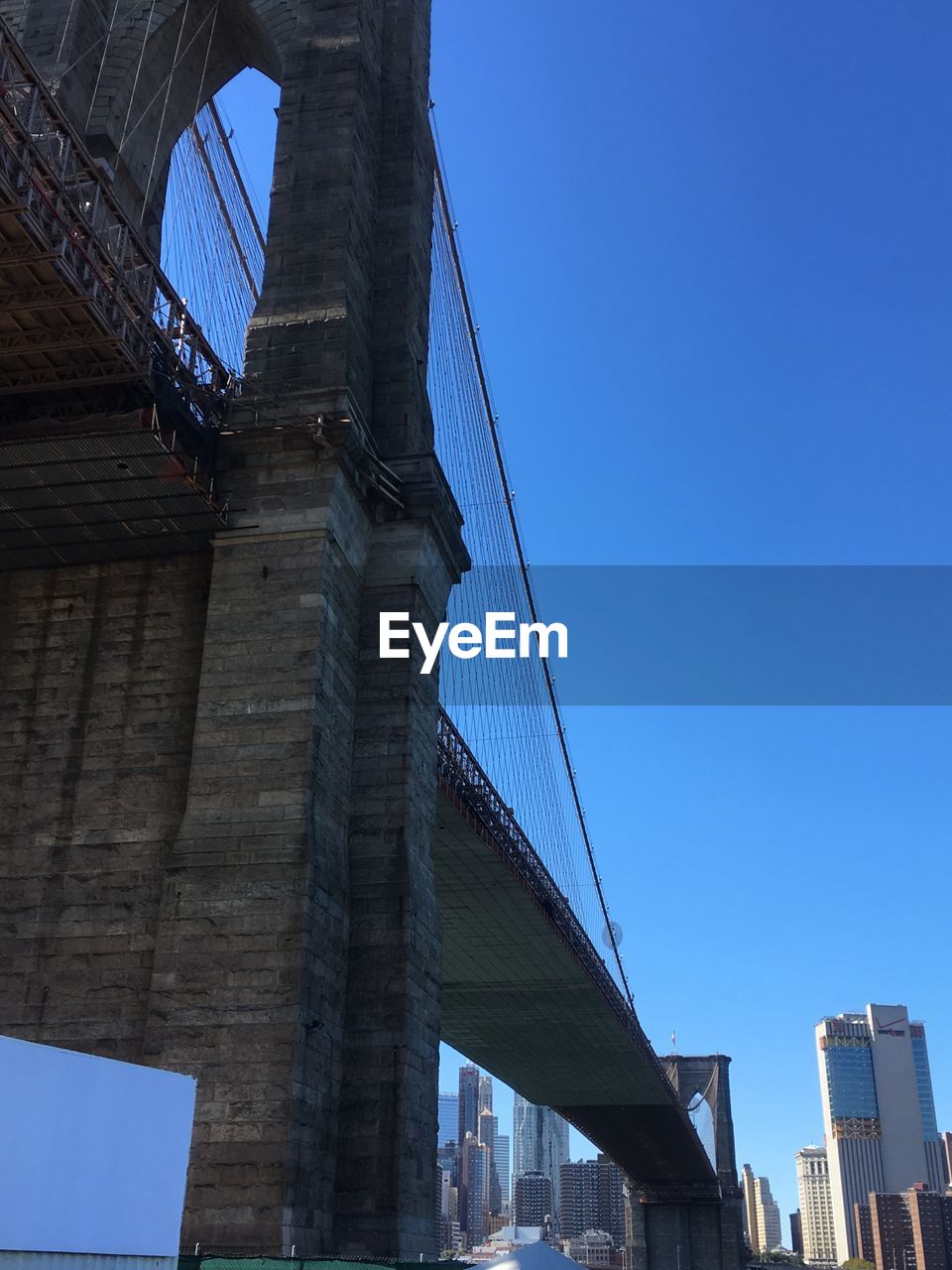 Low angle view of golden gate bridge against clear blue sky