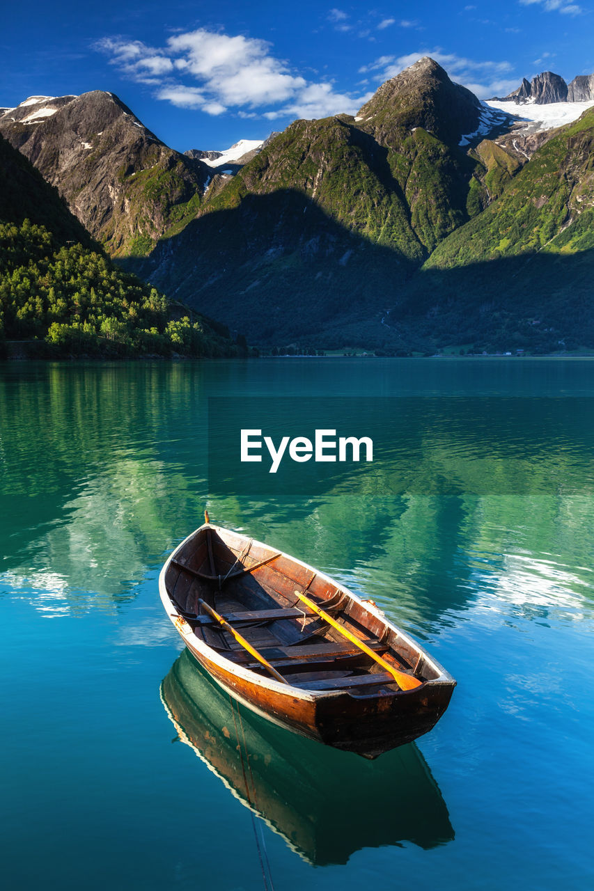 Scenic view of lake by mountains against sky, hjelle, norway