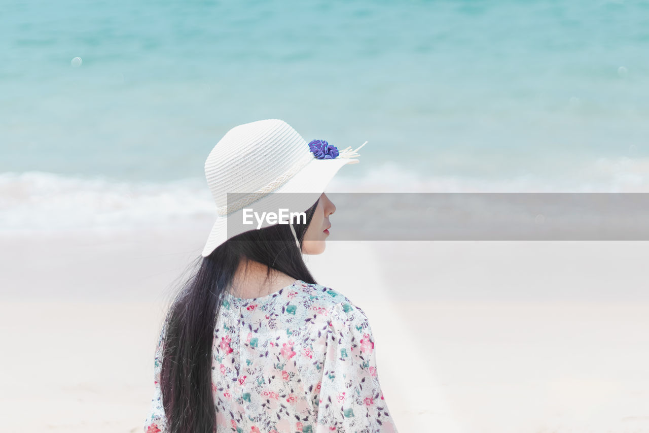 Happy woman hat enjoy summer vacation on the beach.