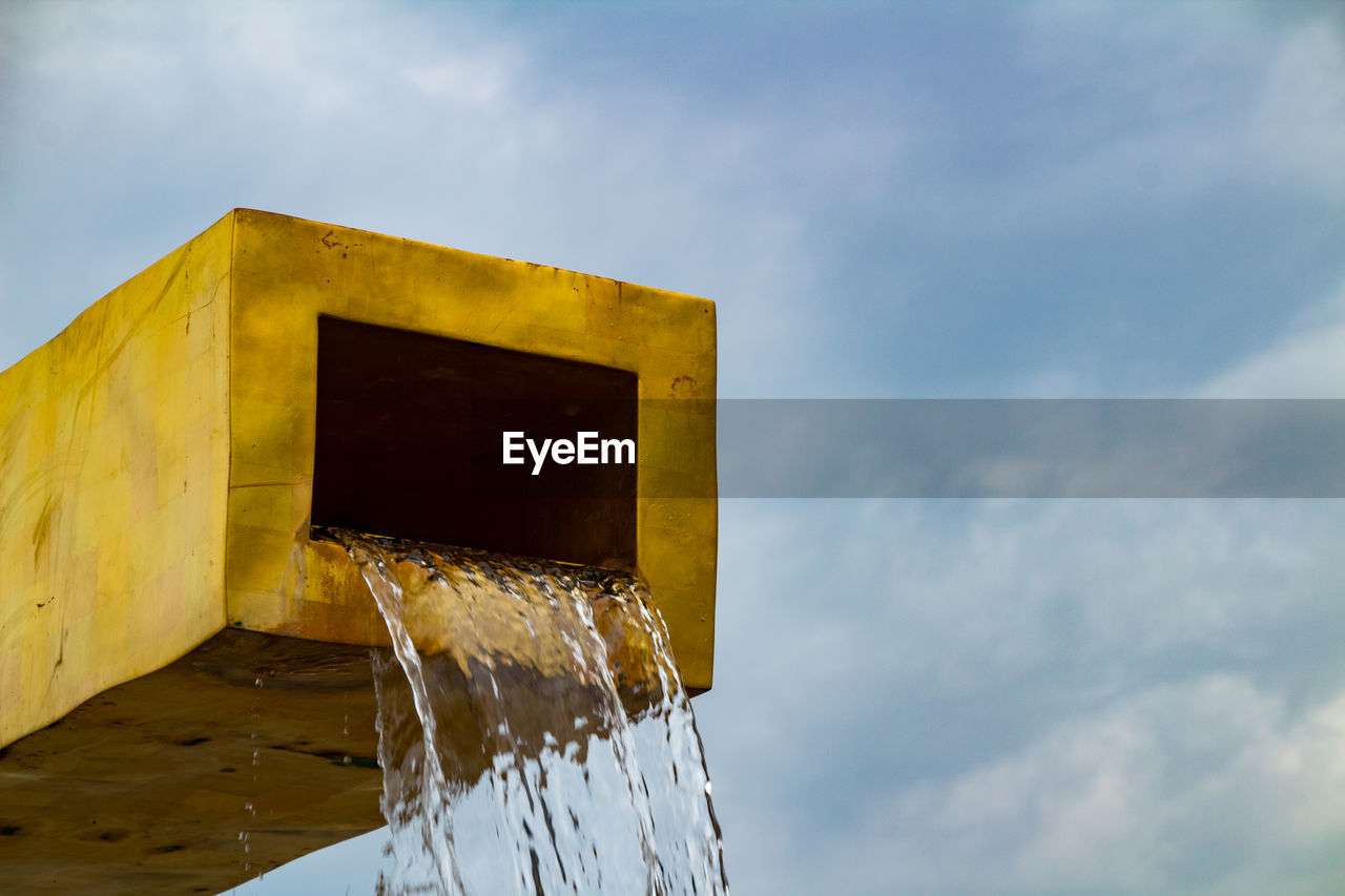 Low angle view of fountain structure against sky