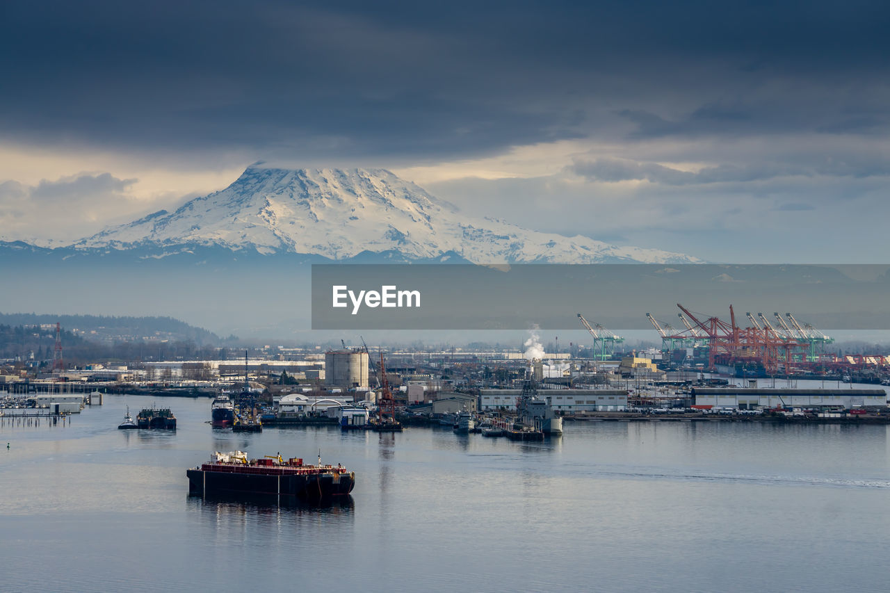 A view of the port of tacoma beneath mount rainier.
