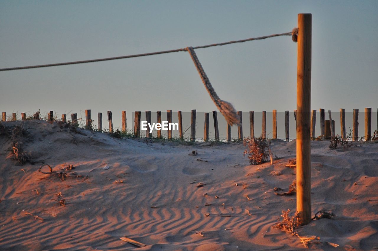 Scenic view of beach against sky during winter