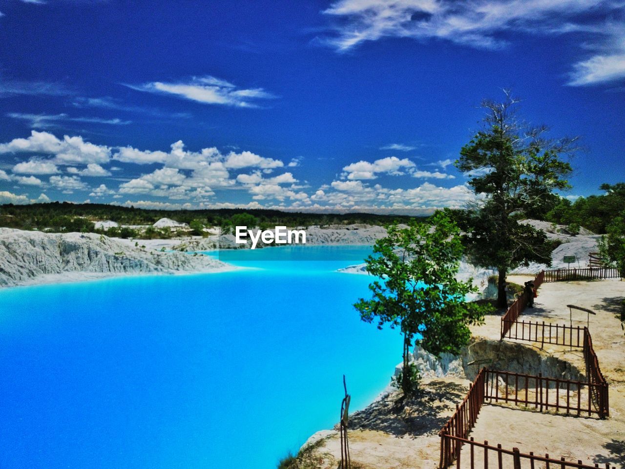 SWIMMING POOL AGAINST BLUE SKY