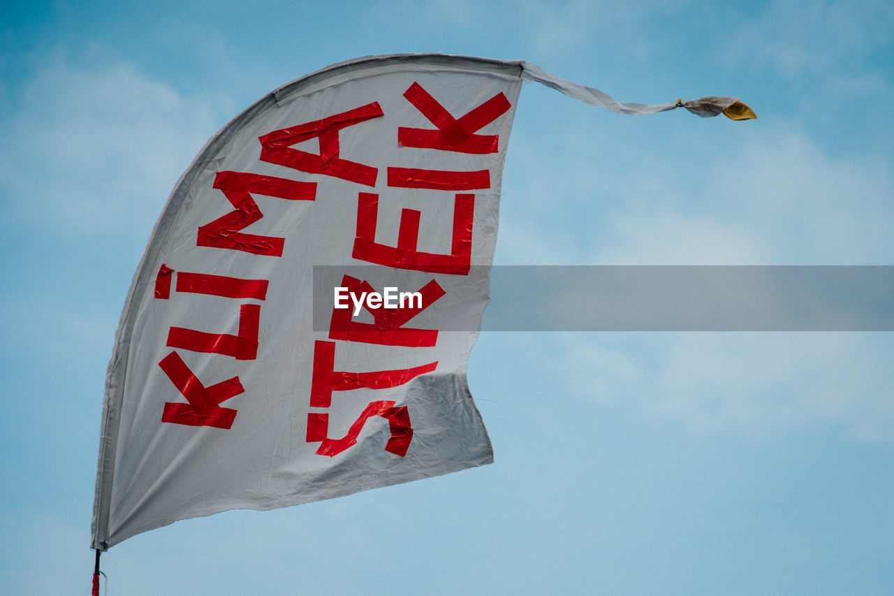 LOW ANGLE VIEW OF FLAG AGAINST SKY