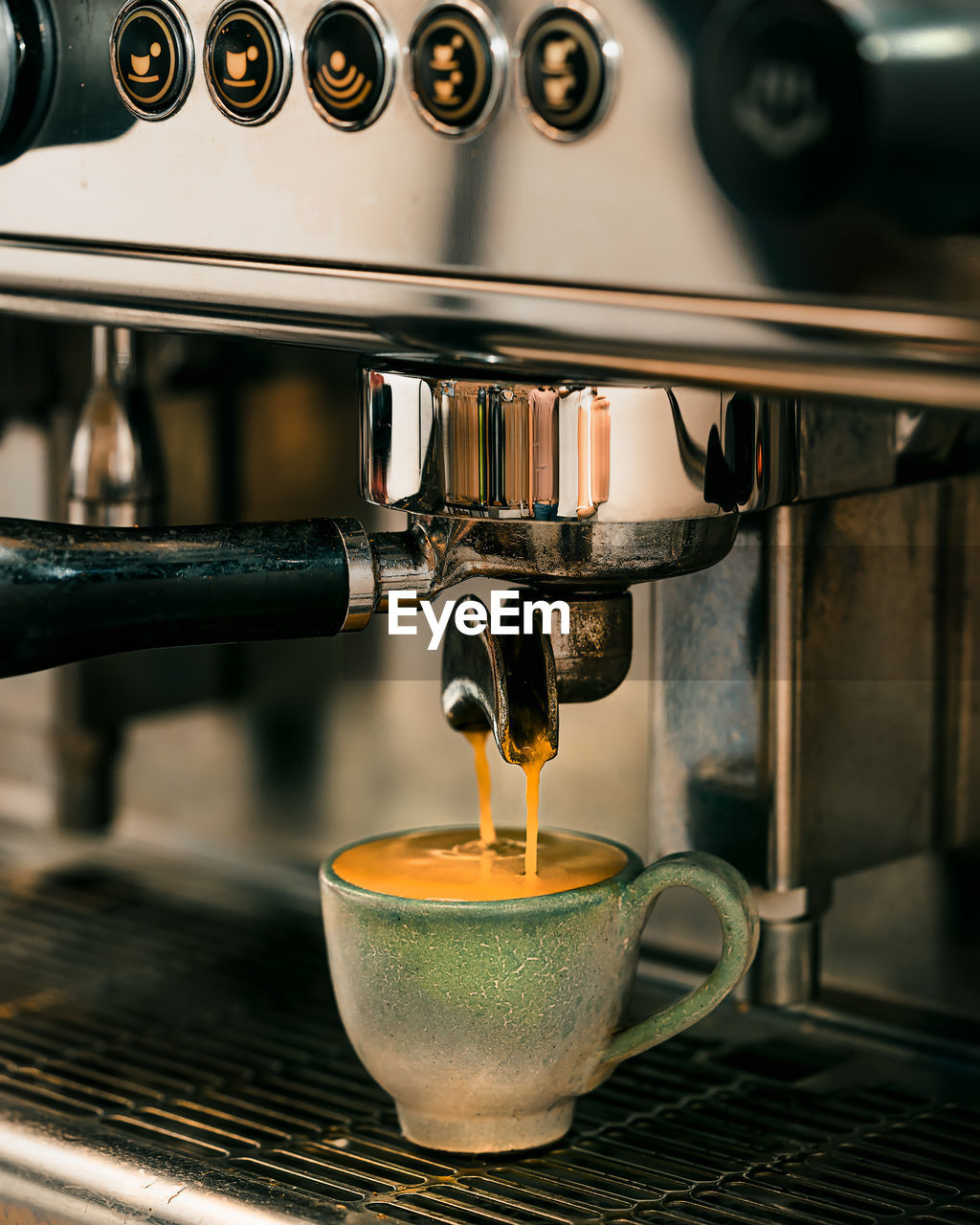 close-up of coffee pouring in sink