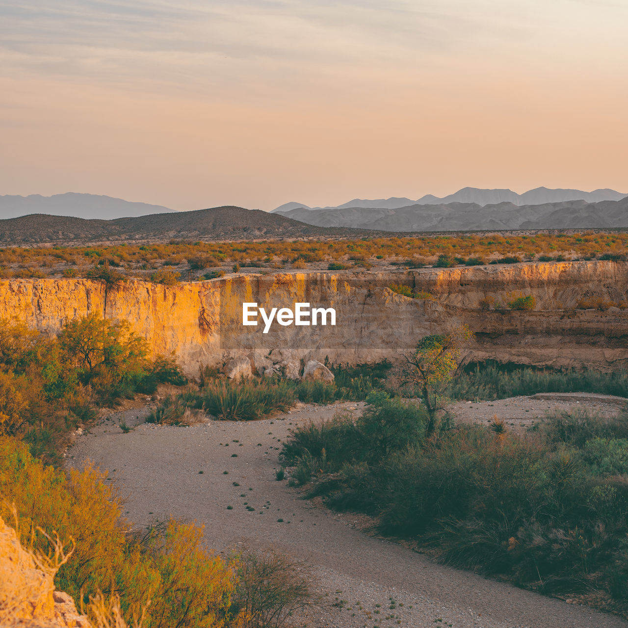 Scenic view of landscape against sky during sunset