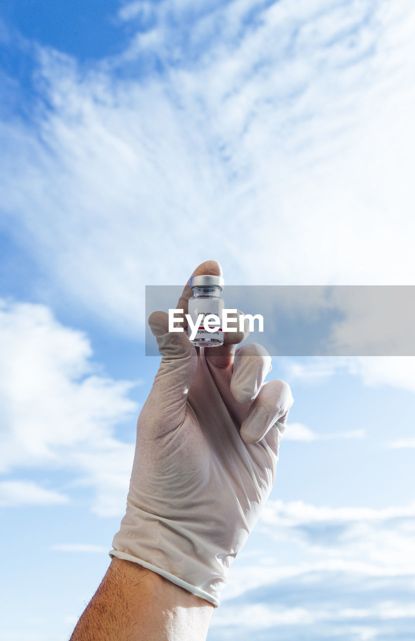 Doctor's hand showing covid-19 vaccine, new york