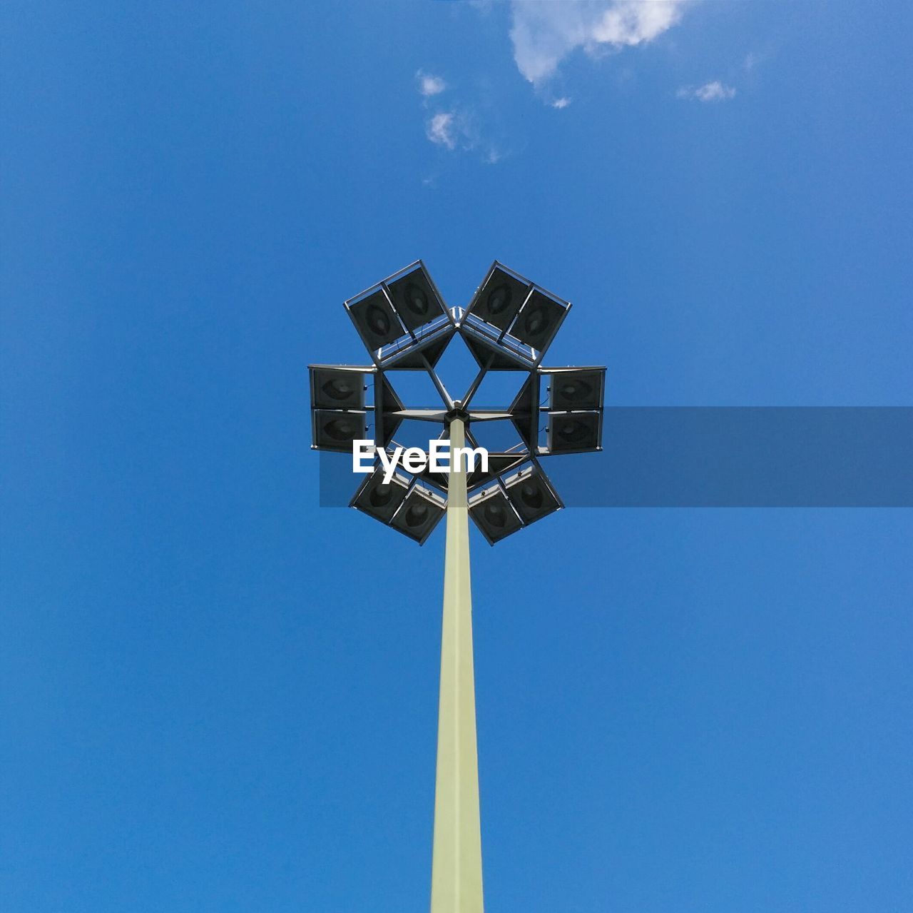 Low angle view of floodlight against sky