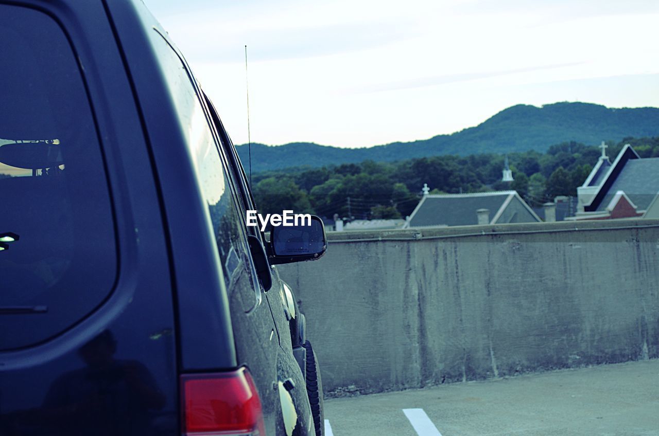 CLOSE-UP OF CARS ON THE ROAD