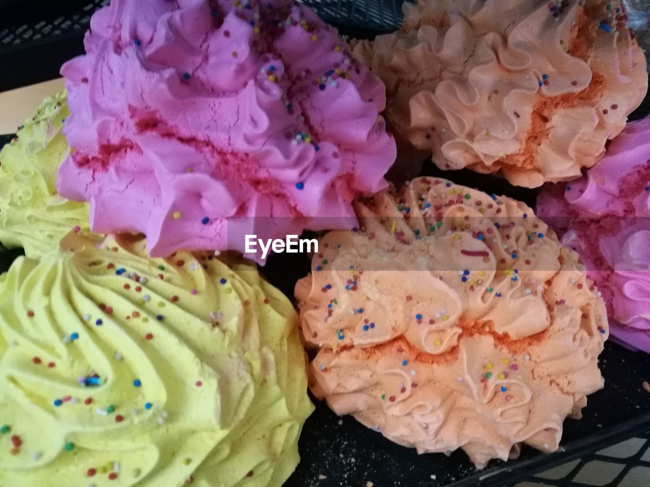 HIGH ANGLE VIEW OF MULTI COLORED FLOWERS IN PLATE