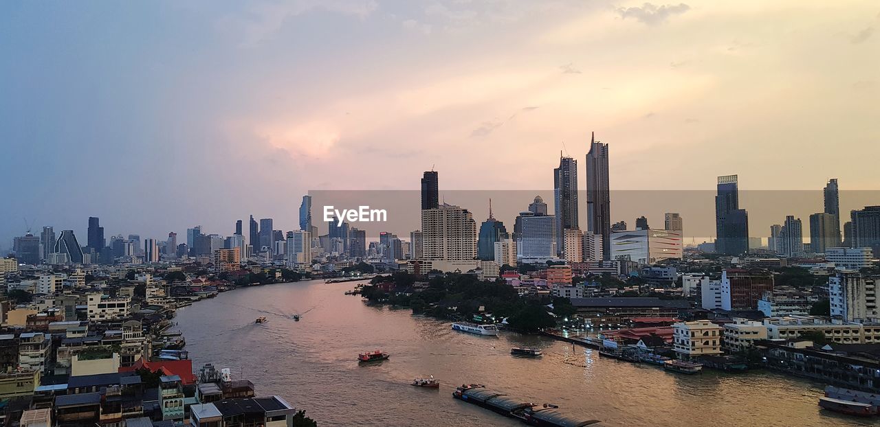 VIEW OF BUILDINGS IN CITY DURING SUNSET