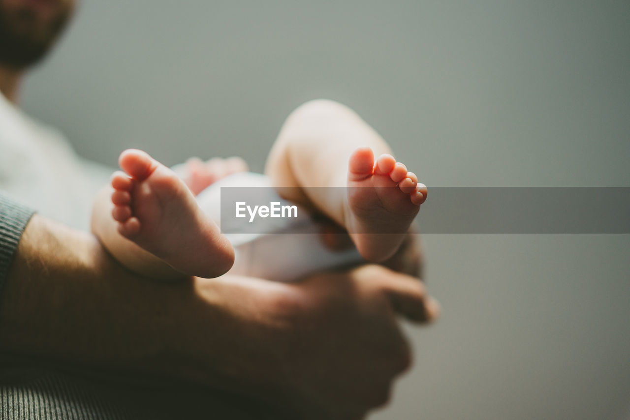 Close up father holding baby