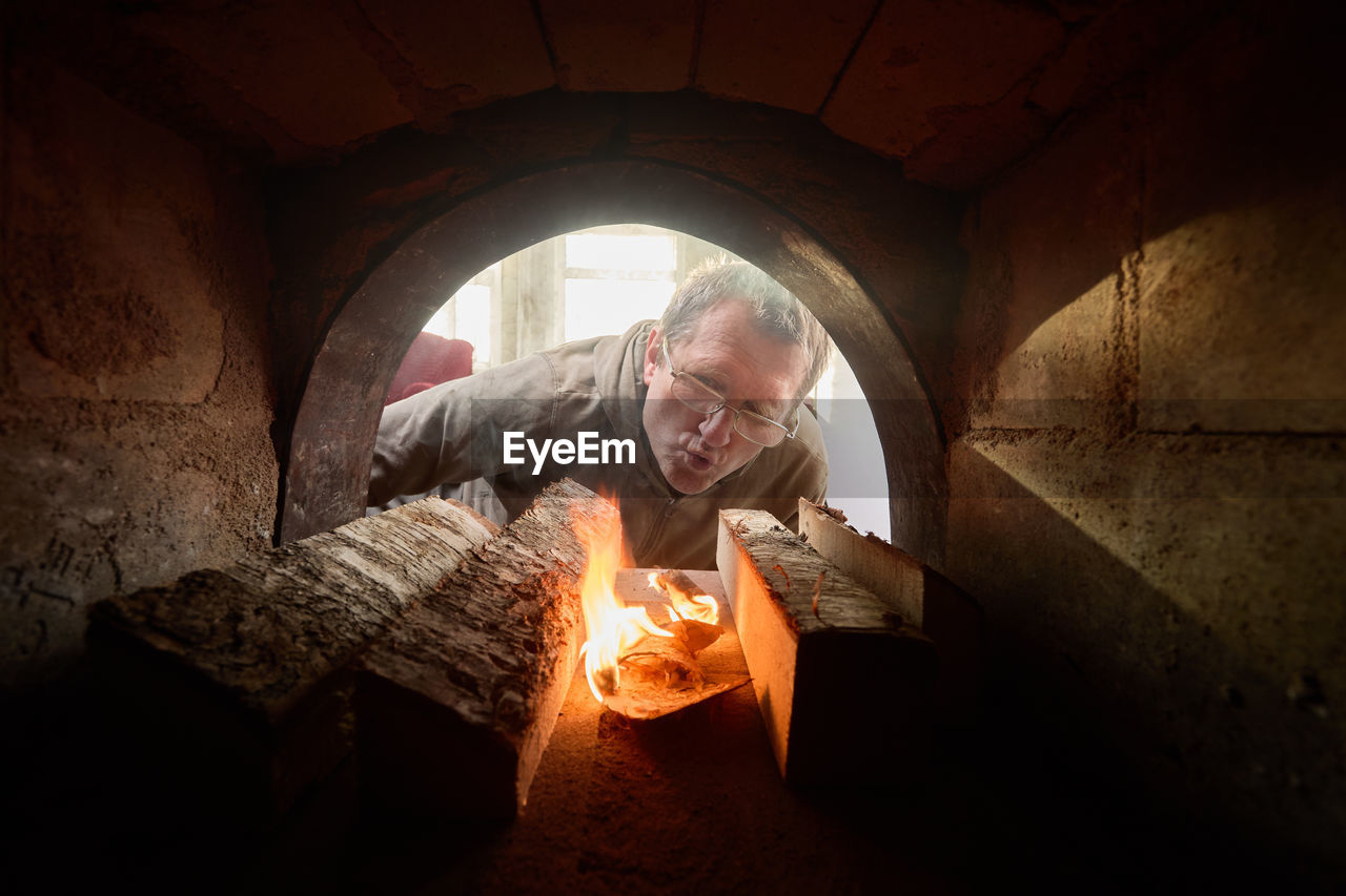 low angle view of man standing in cave