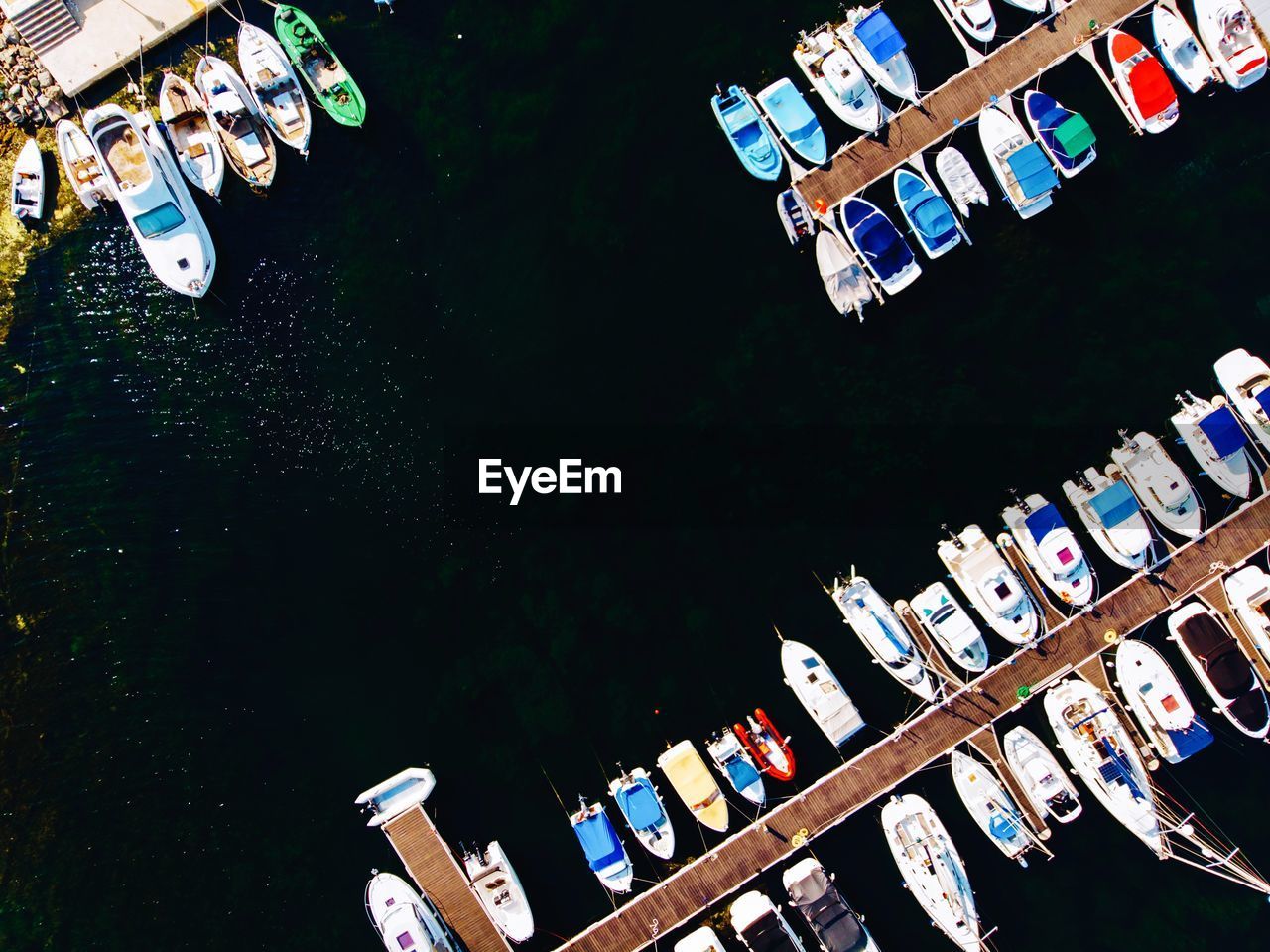 Aerial view of boats moored at harbor