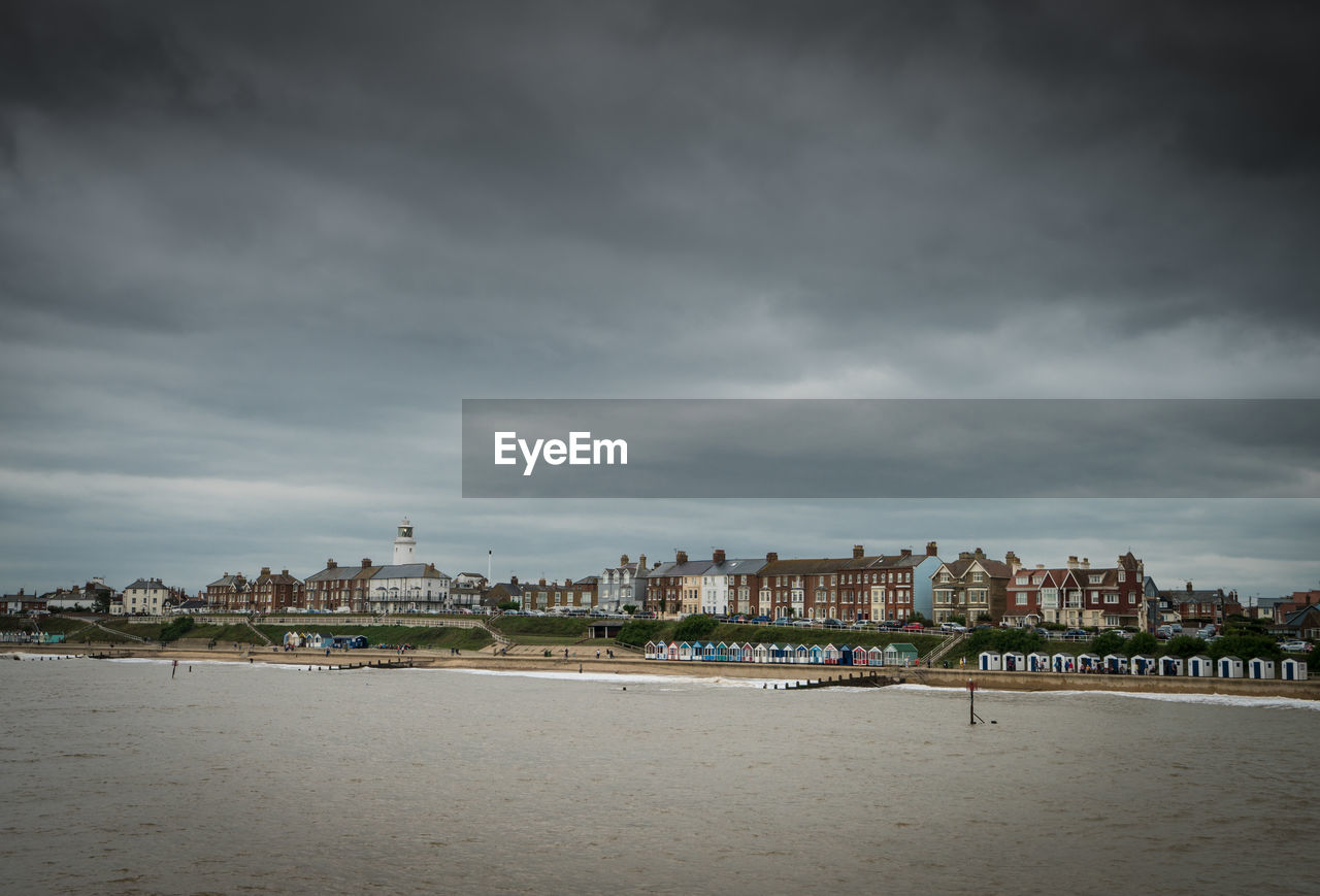 Scenic view of sea and buildings against sky