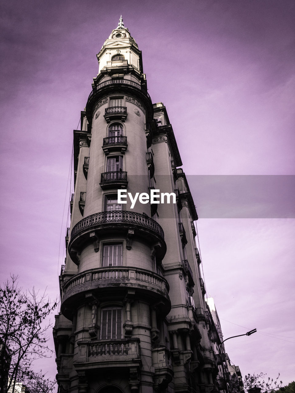 Low angle view of building against cloudy sky