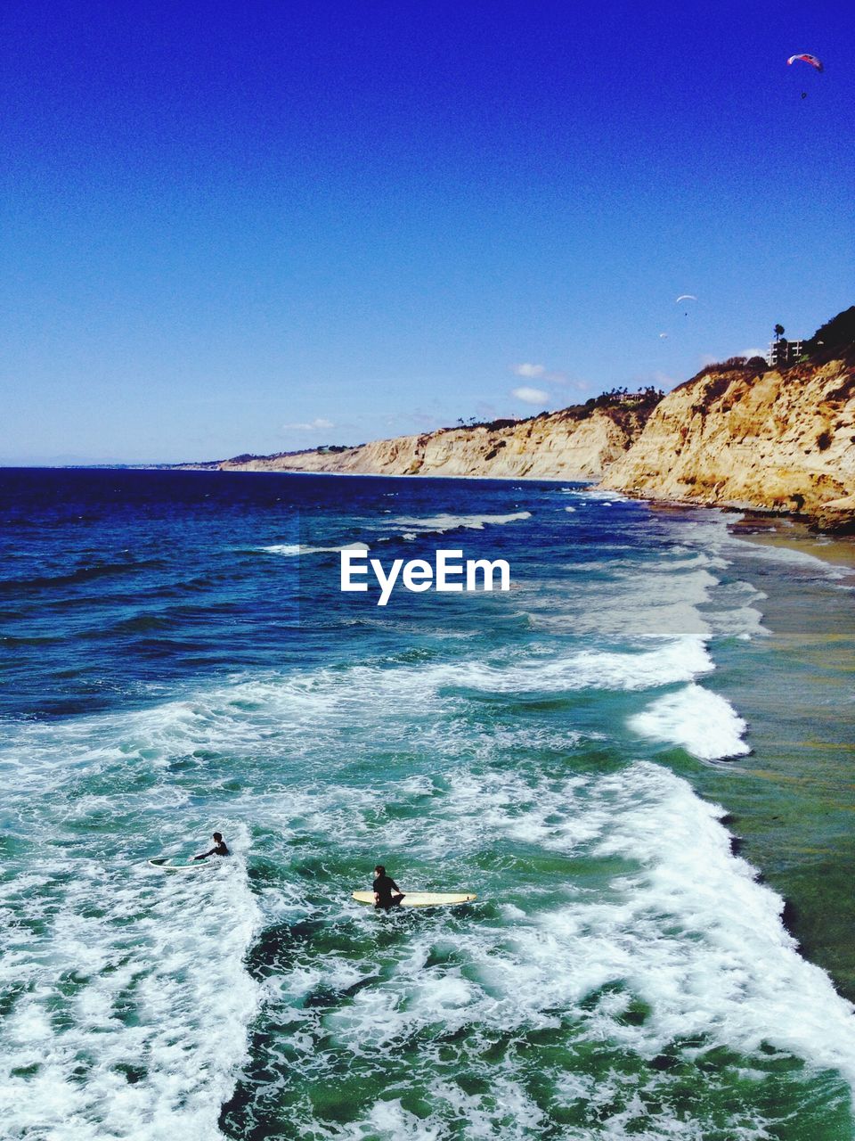 Scenic view of sea against clear blue sky