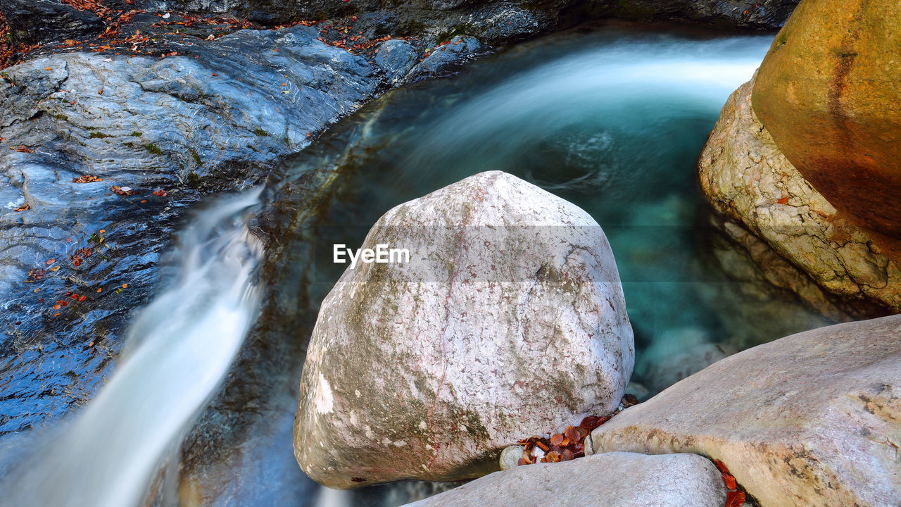 Close-up of rocks in river