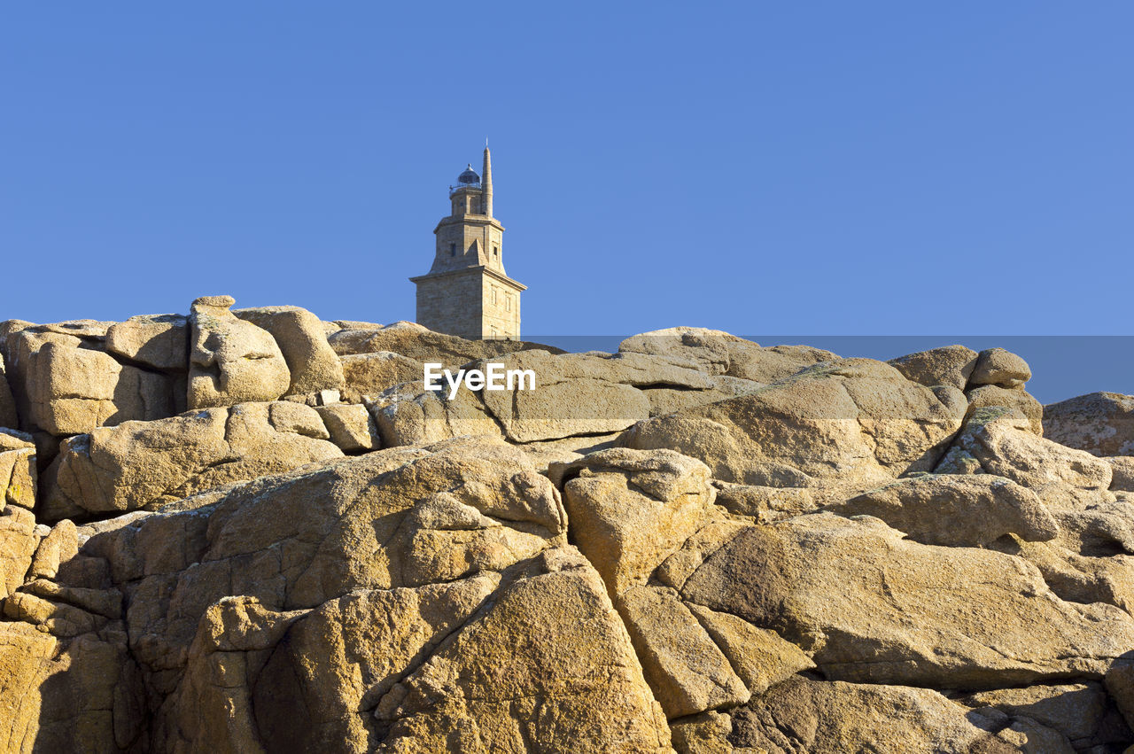 Tower of hercules against clear blue sky