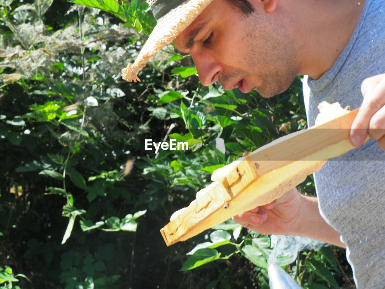 side view of young man looking at farm