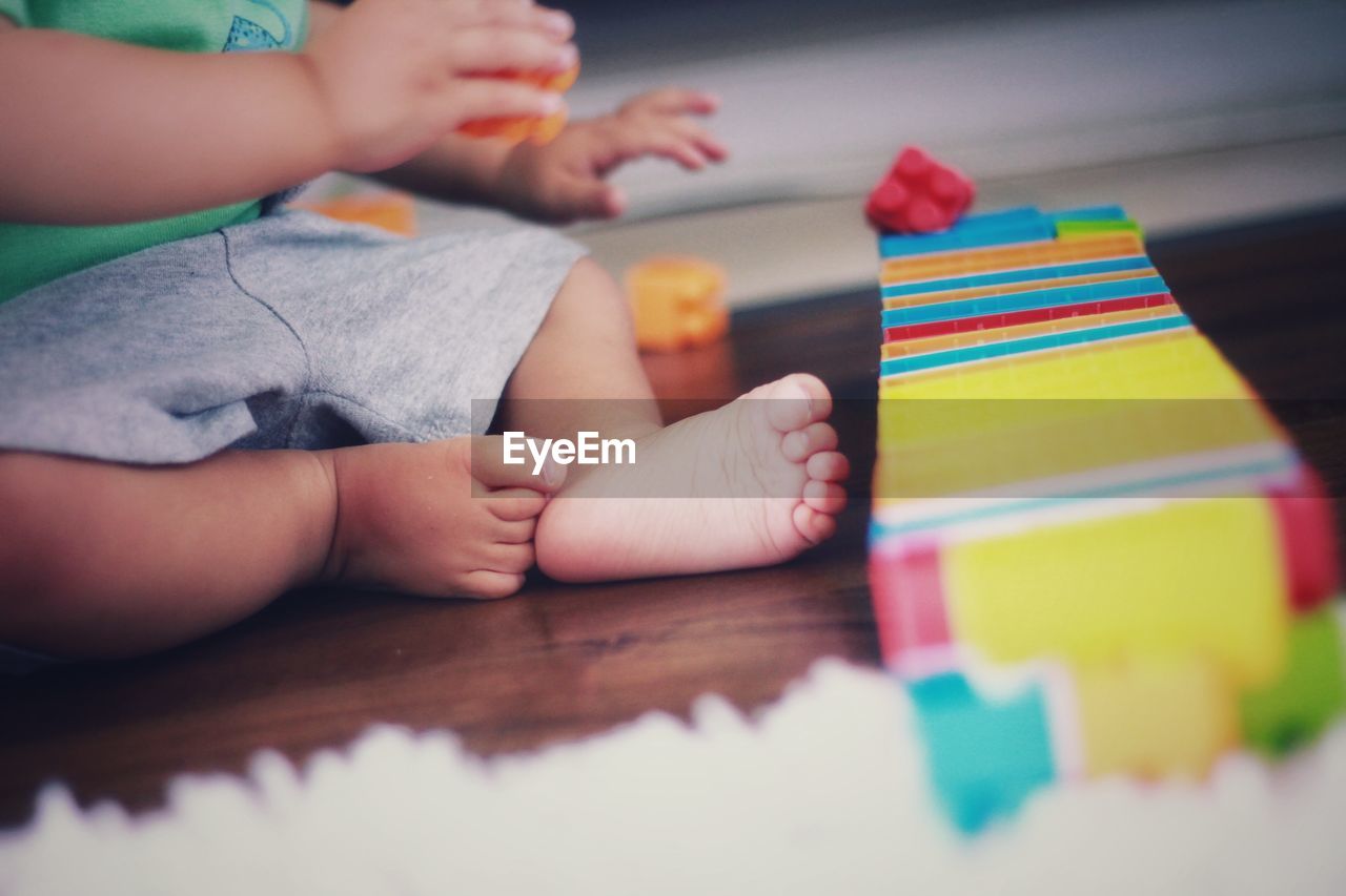 Boy playing with toy at home