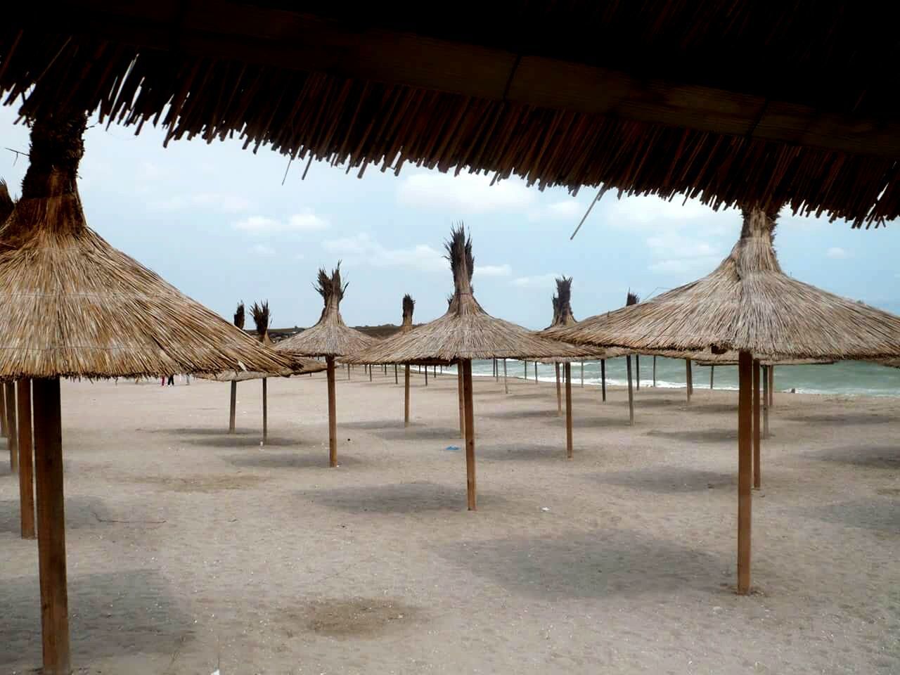 Thatched roof shades on beach