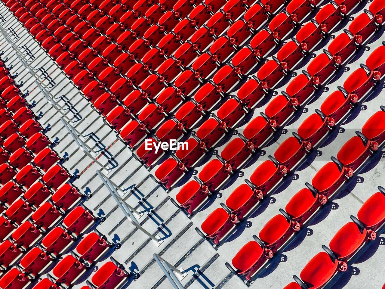 High angle view of red seats at stadium