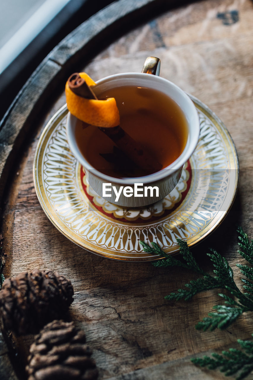 food and drink, tea, drink, hot drink, food, crockery, mug, cup, tea cup, refreshment, no people, indoors, oolong, healthy eating, high angle view, saucer, da hong pao, assam tea, table, freshness, wellbeing, wood, plate, studio shot, kitchen utensil, still life, teapot, coffee cup, fruit