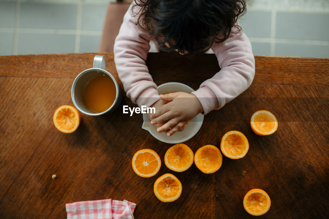 High angle view of woman preparing food on table