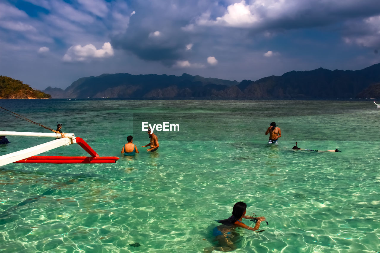 TOURISTS ENJOYING IN SEA