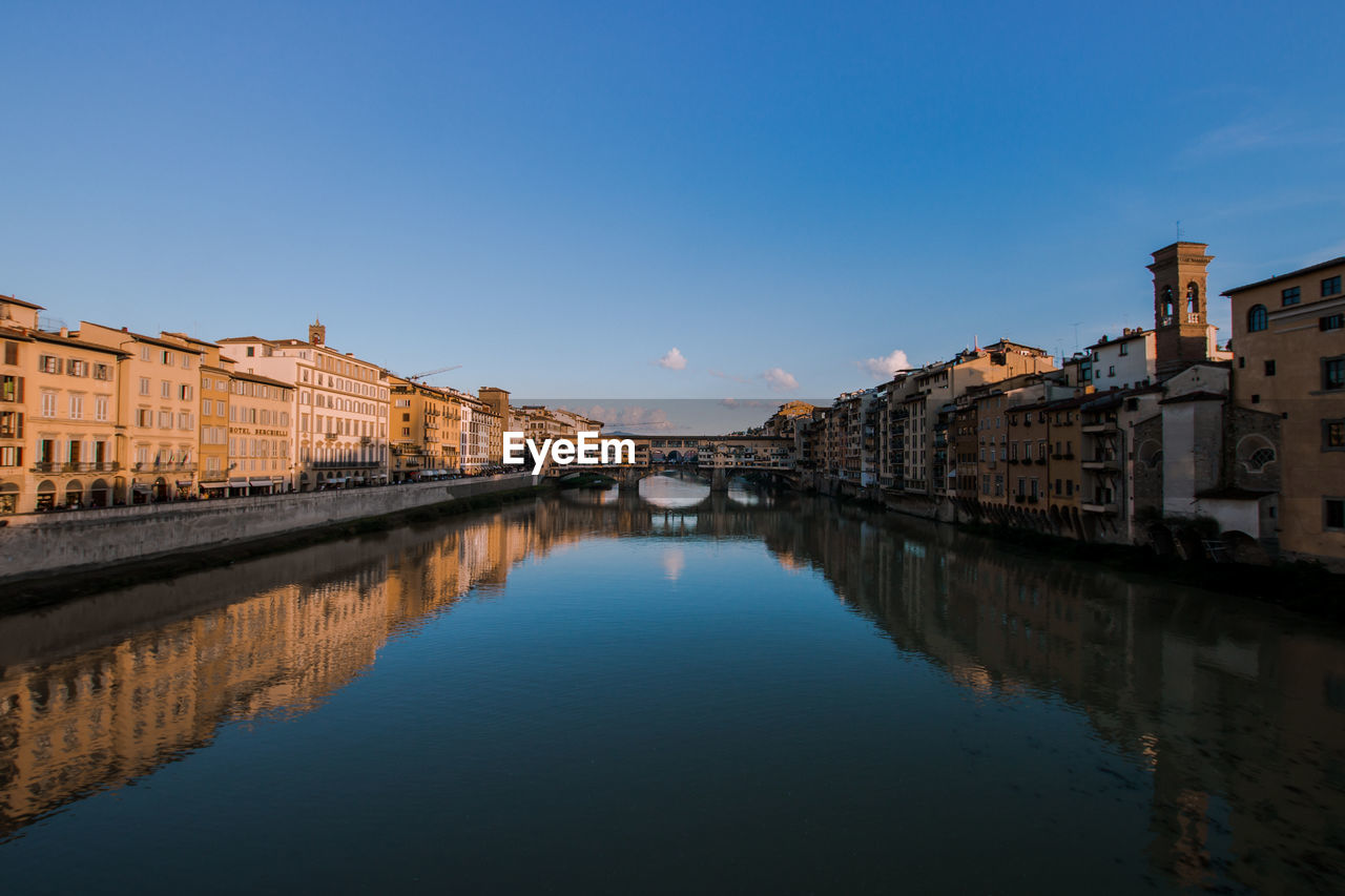 View of ponte vecchio over river against clear sky