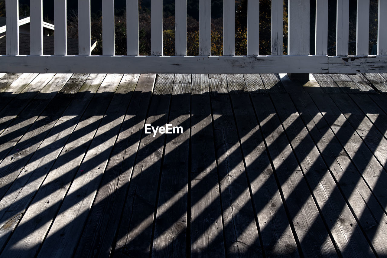 shadow, sunlight, line, pattern, architecture, no people, iron, day, outdoor structure, built structure, nature, outdoors, metal, wood, security, roof, full frame, in a row, wall, protection, repetition, backgrounds