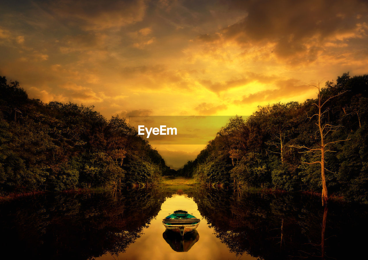 SCENIC VIEW OF RIVER AGAINST SKY AT SUNSET