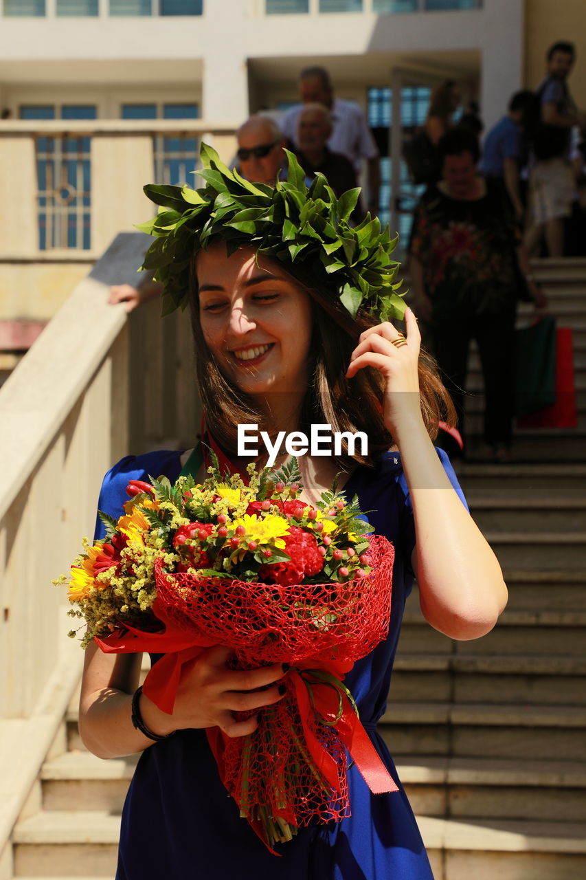 Woman holding flower bouquet