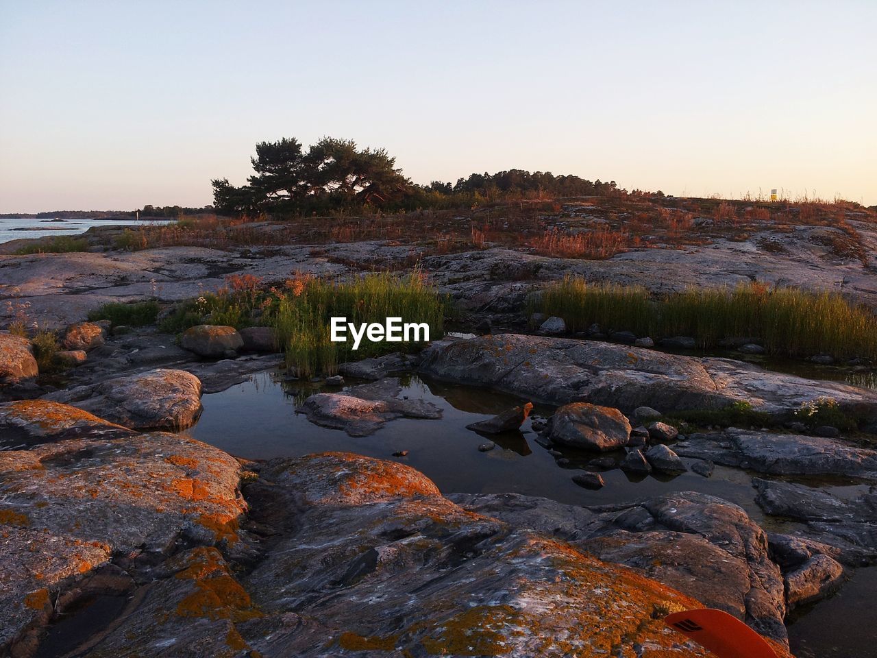 SCENIC VIEW OF SEA AT SUNSET