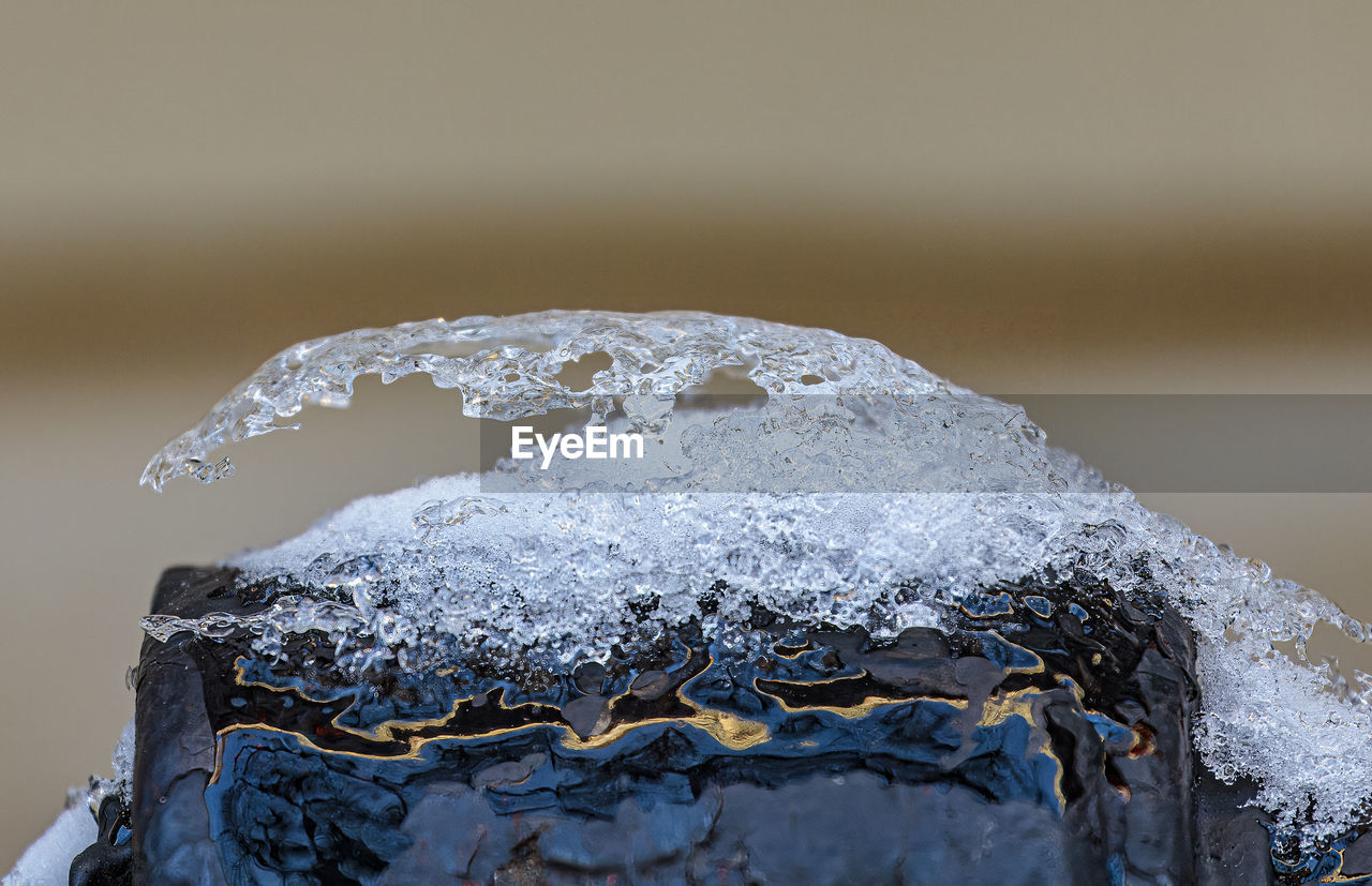 winter, ice, freezing, snow, macro photography, close-up, water, nature, frost, melting, no people, cold temperature, blue, frozen, outdoors, environment, reflection, rock, focus on foreground