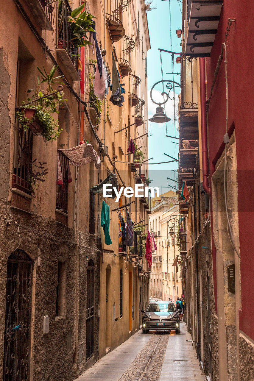 NARROW ALLEY AMIDST BUILDINGS