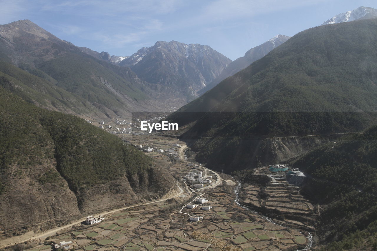 High angle view of road amidst mountains against sky