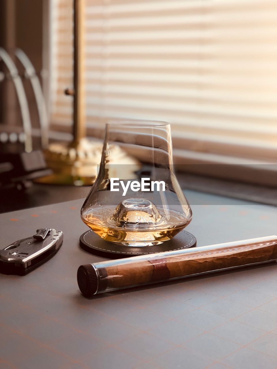 Close-up of whisky glass on table