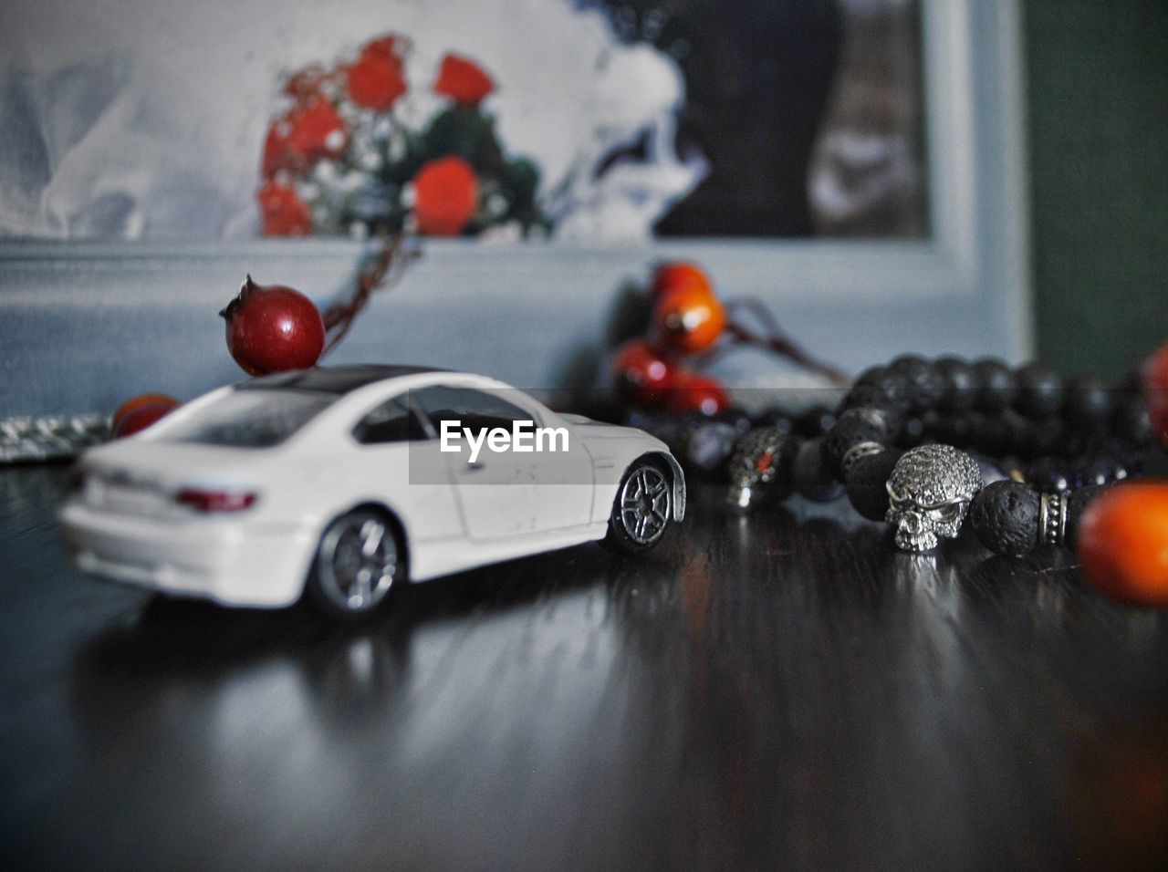 CLOSE-UP OF TOY CAR ON TABLE AT HOME