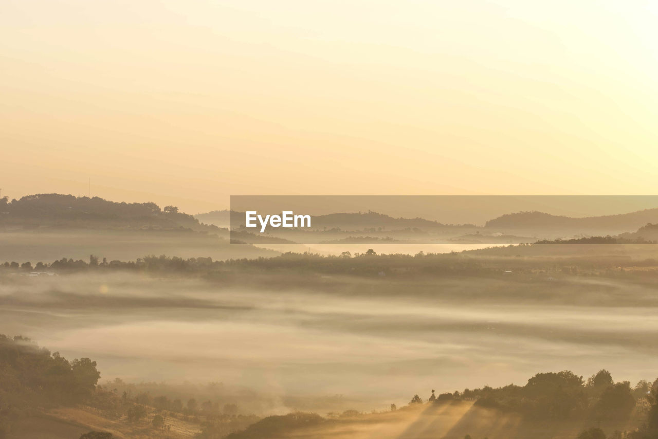 Scenic view of landscape against sky during sunset