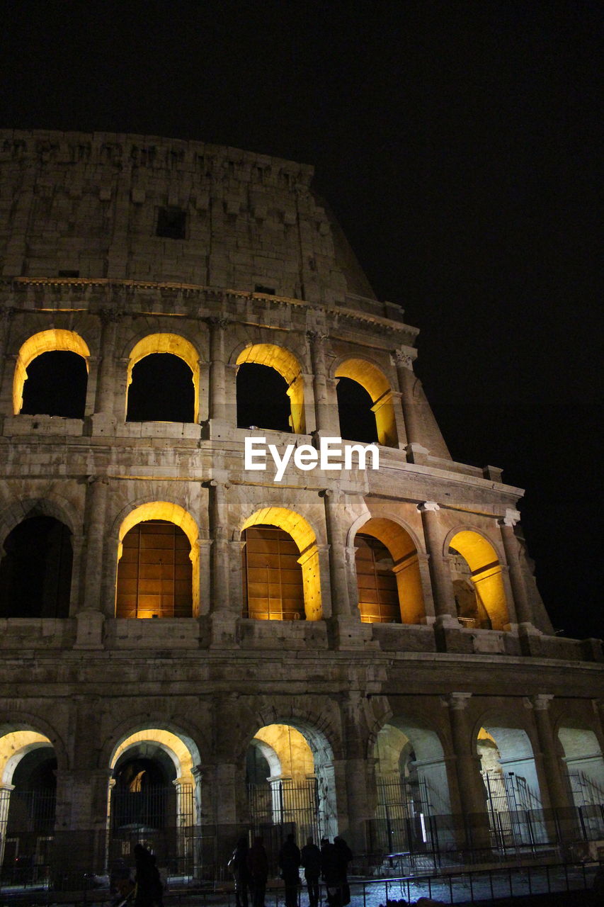 LOW ANGLE VIEW OF ILLUMINATED BUILDING