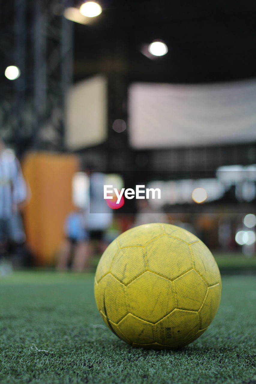 Close-up of soccer ball on field