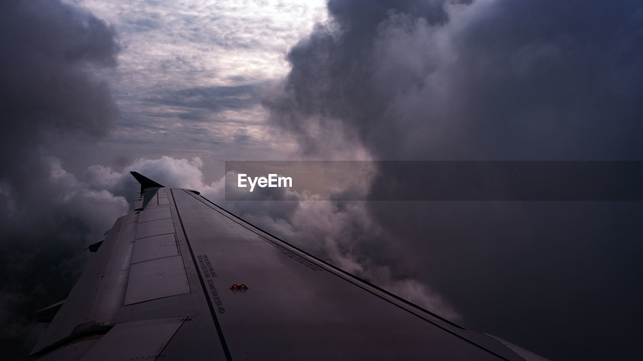 LOW ANGLE VIEW OF AIRPLANE IN SKY