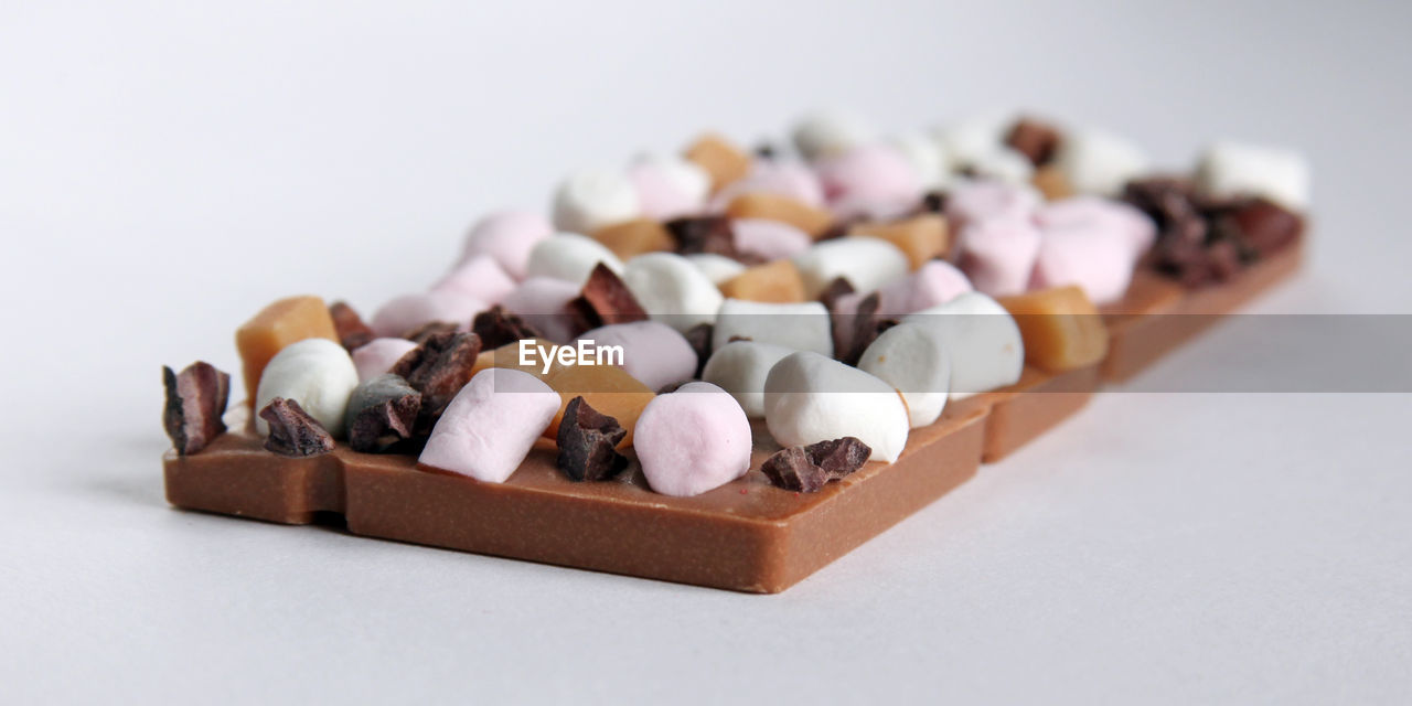 Handmade chocolates on white background