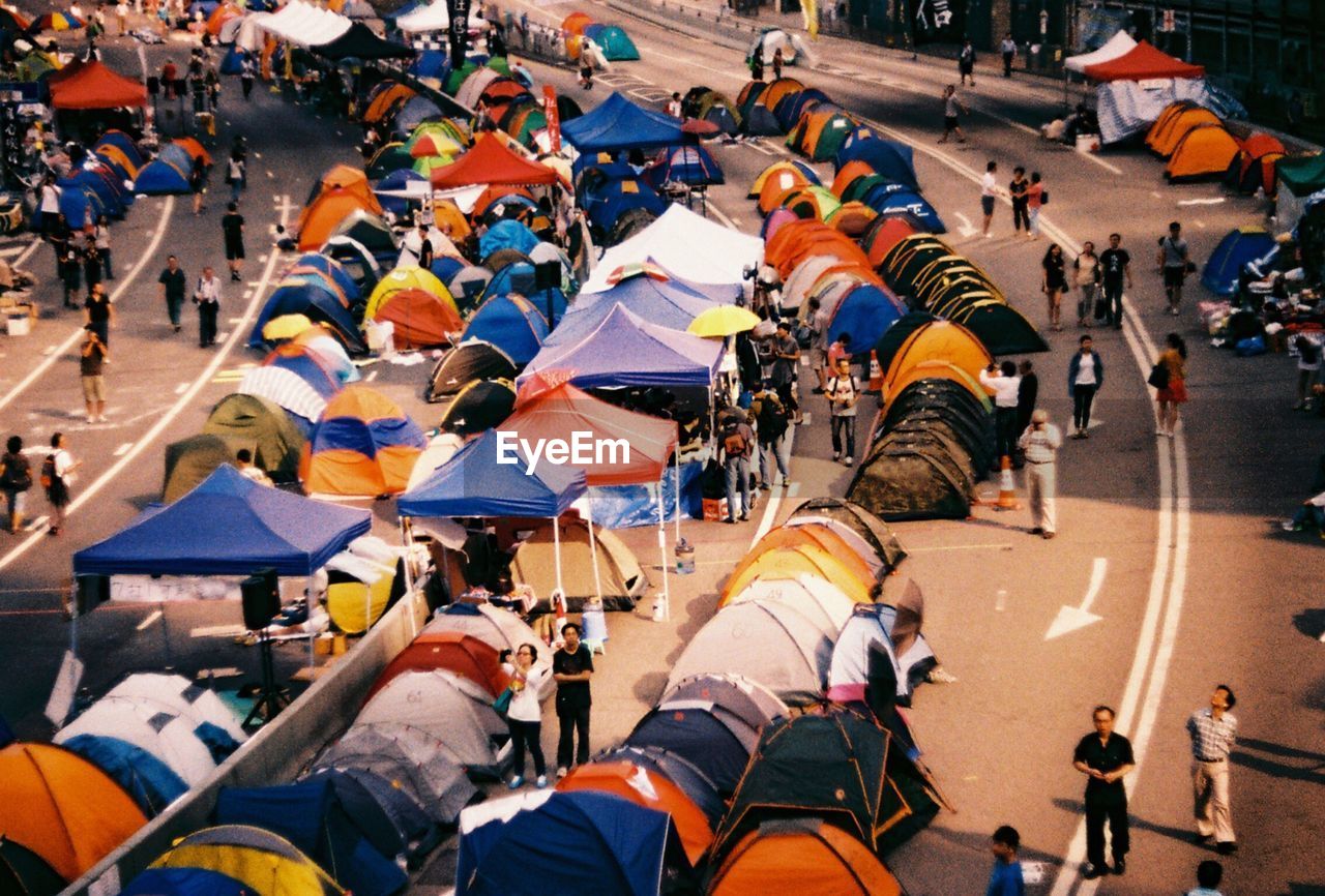 Tourists with tents on street