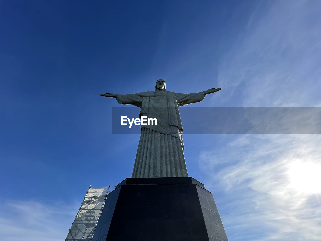 LOW ANGLE VIEW OF A STATUE OF A TEMPLE