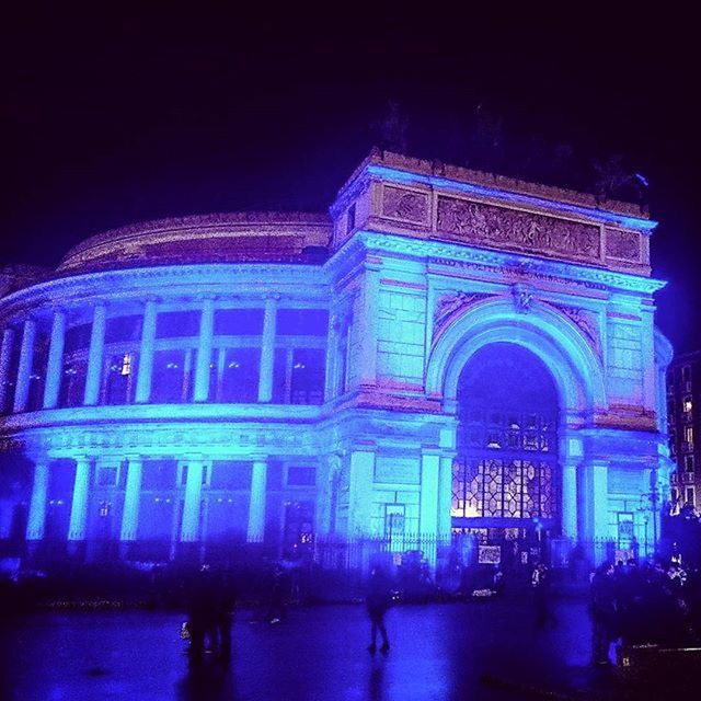 VIEW OF ILLUMINATED PEOPLE AT NIGHT