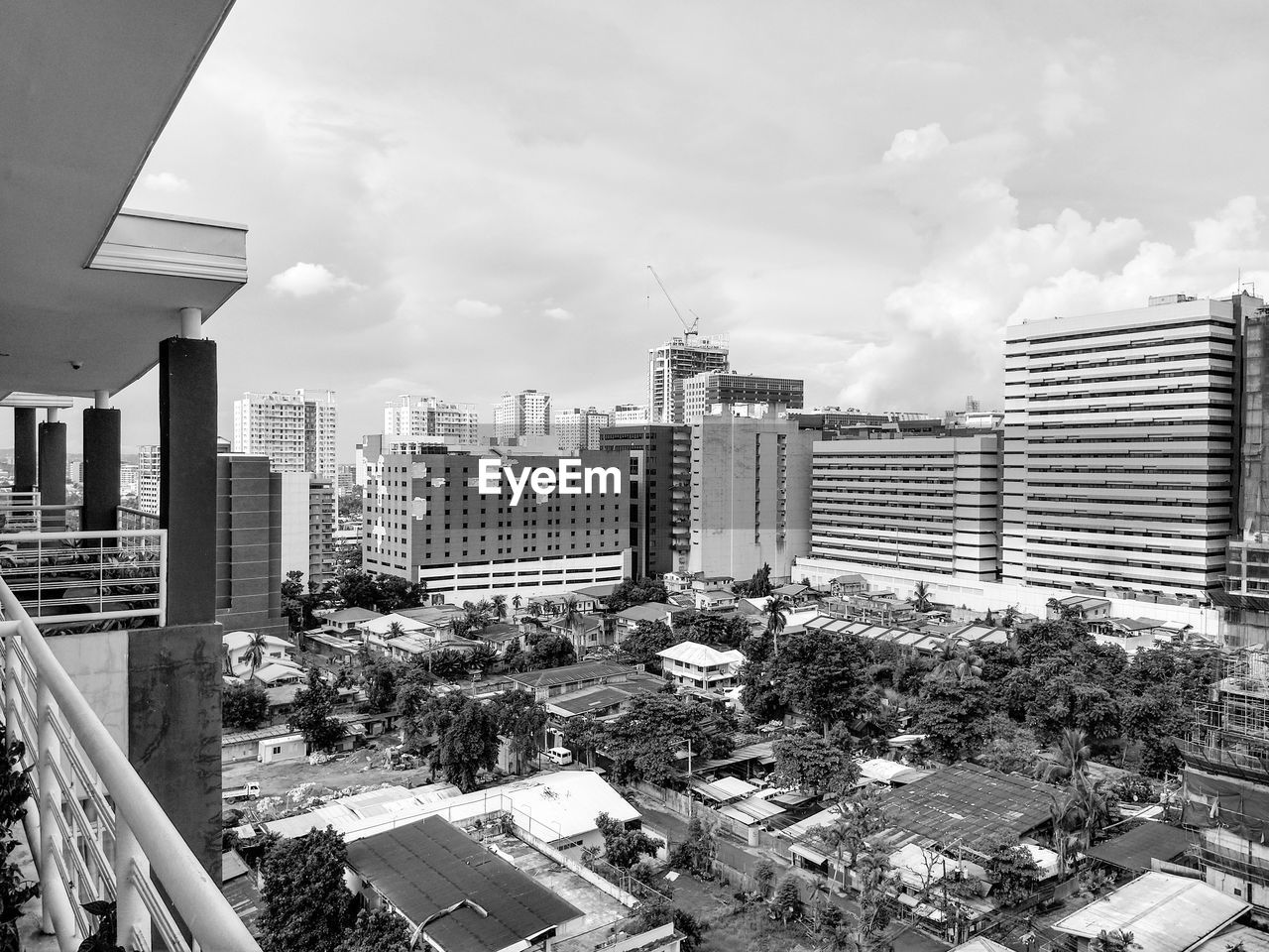 architecture, building exterior, built structure, city, urban area, building, skyline, cityscape, sky, metropolis, office building exterior, skyscraper, black and white, residential area, downtown, metropolitan area, residential district, tower block, cloud, landscape, monochrome photography, monochrome, nature, urban skyline, city life, high angle view, no people, office, day, neighbourhood, outdoors, development, travel destinations, downtown district, transportation, street
