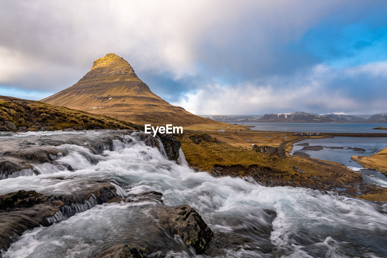 The kirkjufell mountain and the kirkjufellfoss waterfall at snæfellsnes peninsula in iceland